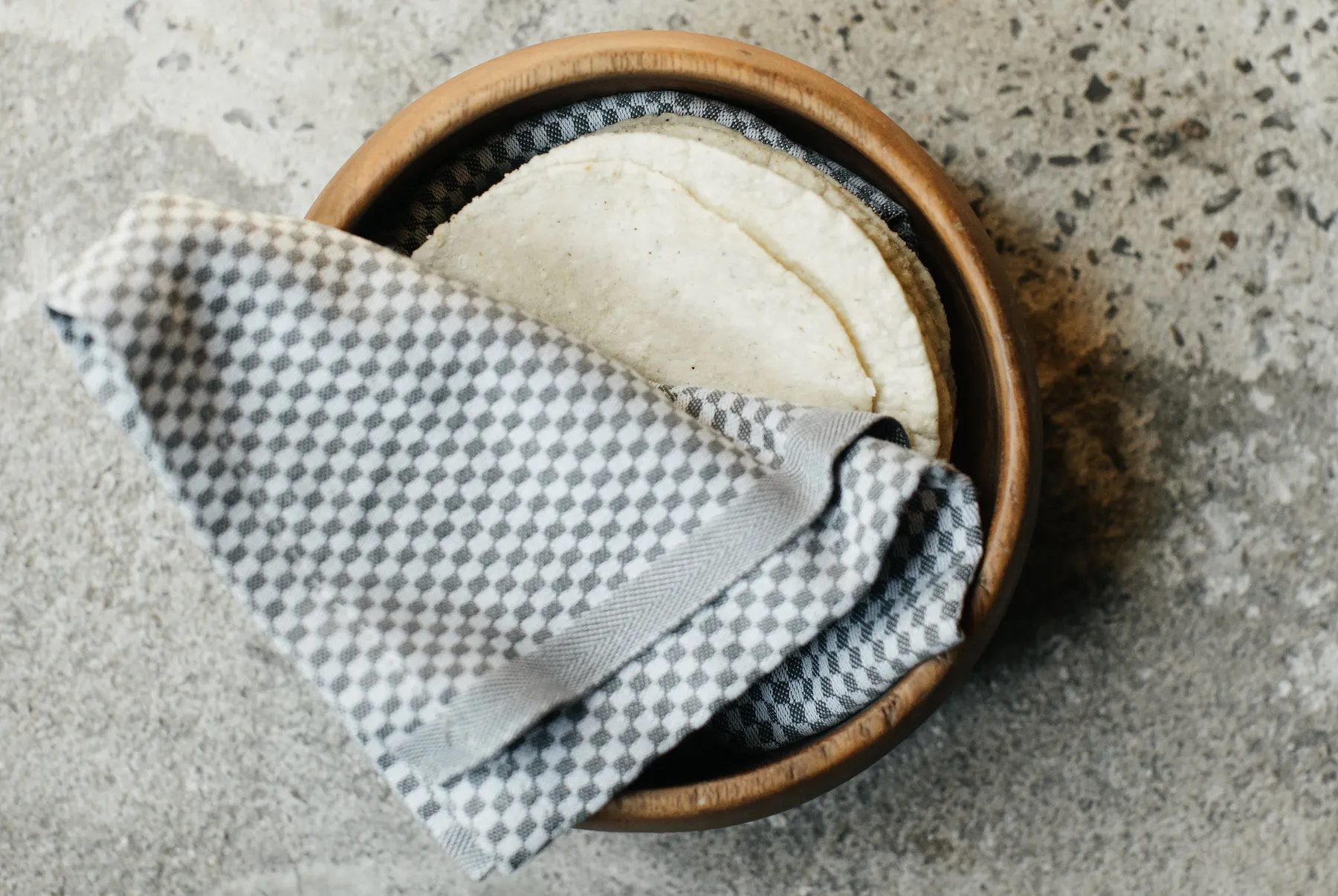 wooden bowl with napkin on it